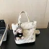 Moda Inverno 2025 Nova Bolsa Saco Simples Estilo Doce Nicho Coreano Bolsa de Ombro Feminina Bolsa Feminina Bordada com Fio Acolchoado