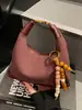 Bolsas Femininas Exclusivas e Modernas de Nicho Outono e Inverno 2025 Nova Moda Versátil Bolsa de Ombro Transversal Bolsa de Mão Bolsa de Bolinho