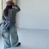 Calça jeans feminina de primavera e outono, novo estilo 2026, casual, estampa de graffiti com letras estilo americano, calça jeans de perna larga, moderna para vendas transfronteiriças