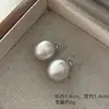 Aretes de bola de trefilado de alambre aretes de bola aretes de bola redonda de metal estilo simple Joker aretes de bola redonda aretes de lujo ligero alta sensación aretes europeos y americanos Yiwu al por mayor