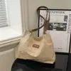 Novas Bolsas Populares Outono e Inverno 2025 Grande Capacidade Elegante Bolsa de Ombro para o Dia a Dia Bolsa Tote Casual Elegante de Braço