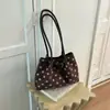 Bolso de mano simple de lunares estilo coreano Shuai Mi Jia para mujer, nuevo bolso tote moderno y elegante de nicho para el día a día 2026