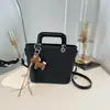 Bolso de cubo de moda con patrón tejido para mujer, nuevo estilo coreano 2026, bolso de mano versátil para salidas diarias y para ir al trabajo, bolso cruzado