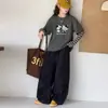 Pantalones anchos de trabajo para niña con múltiples bolsillos, pantalones largos casuales rectos holgados de primavera y otoño, atuendo elegante y moderno
