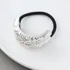 Estilo punk europeo y americano metal personalidad alta calidad cuerda para la cabeza semicírculo tubo redondo anillo para el pelo cuerda elástica para el pelo Balot fabricantes al por mayor