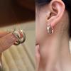 Pendientes minimalistas de estilo frío con diseño de nicho europeo y americano con aguja de plata S925, pendientes modernos con sentido del humor para mujer.