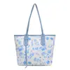 Bolsa Grande Color-blocking Feminina 2026 Primavera/Verão Nova Fofa Estampa de Desenho Animado Bolsa de Ombro Única Versátil Tendência Popular Bolsa Tote