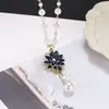 Collar de Perlas de Camelia que Gotea Aceite Nueva Moda para Mujer Exquisita Cadena Larga para Suéter Colgante Versátil de Ropa de Alta Gama