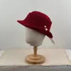 Nuevo sombrero de pescador de punto calado vintage para mujer, elegante y que adelgaza la cara, con decoración de perlas, versátil y elegante
