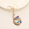 Venta Caliente Colgante Llavero Pavo Real Multicolor Incrustado de Diamantes Pieza de Llavero de Coche Colgante de Llave de Bolso con Temperamento Venta al por Mayor