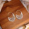 Pendientes de anillo liso exagerado con aguja de plata S925 de estilo europeo y americano para mujer, pendientes de temperamento simple Joker de lujo ligero de alta gama, venta al por mayor