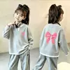 Top de punto gofre estilo coreano, imitación de dos piezas, manga larga para niñas, nuevo estilo primavera/otoño para niños medianos y grandes, versátil, elegante, capa base holgada