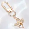 Lujo Ligero Chapado en Oro Charms Completos de Diamante Cierre de Langosta Forma D Colgante Triangular Redondo Accesorios para Llaves Fábrica de Origen Venta al por Mayor