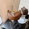 Bolsa de Ombro Feminina Lisa 2026 Nova Tendência Simples Bolsa de Axila Bolsa Transversal de PU Macio Versátil Bolsa Dumpling