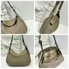 2026 Nova Bolsa Feminina de Couro Genuíno Crescente Senso de Design Nicho Bolsa Transversal Leve Luxo Sensação de Alto Padrão Bolsa de Mão Bolsa de Ombro