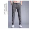 Calça Esportiva Masculina de Verão Fina Estilo Hong Kong Reta Solta Tendência Versátil Calça Masculina Casual de Verão Curta