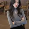 Otoño e invierno nuevo diseño hueco estilo extranjero negro cuello alto camisa base manga larga corte ajustado delgado top de chica hot moda