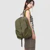 Mochila simple unisex de color sólido, ligera, elegante, portátil, adecuada para viajes y deportes al aire libre, al por mayor