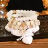 Pulseira Multicamadas Personalizada Grande Laço em Forma de Coração Atacado Conjunto de 4 Peças com Contas de Flor Rosa Joias Estilo Viagem Férias