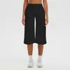 Pantalones capri de yoga de color liso, tela cepillada, estilo europeo y americano, transfronterizos, de cintura alta, control de abdomen, pierna ancha, casual para exteriores, atléticos y para fitness