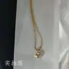 Corrente de clavícula versátil estilo parisiense de aço titânio com diamantes de bolha banhada a ouro 18K para mulheres, luxo leve, com contas de zircônia requintadas, para o trabalho
