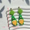 Calle popular transfronteriza. Pendientes verdes del Día de San Patricio, diseño de nicho, pendientes de temperamento de mujer de alta calidad, venta al por mayor