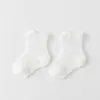 Calcetines de bebé de color liso estilo verano finos calcetines cortos infantiles clase A calcetines de algodón para bebé de malla calcetines de tubo corto para bebé de verano unisex