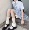 Cálido más terciopelo acolchado bola de pelo protección de pantorrilla frío estilo universitario japonés jk calcetines de pila para niñas otoño e invierno