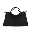 Bolso de mujer casual y simple de gran capacidad modelo nuevo 2026 bandolera cruzada para el hombro para el trabajo bolso de mano de sensación relajada bolso tote
