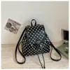Mochila de lunares transfronteriza para mujer, bolsa de viaje ligera, diseño de nicho de alta gama, mochila elegante para el día a día para estudiantes universitarios