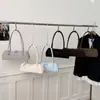 Bolso tipo baguette retro para debajo del brazo para mujer 2026 Primavera Nueva Moda Bolso simple tipo almohada para ir al trabajo Casual Bolso de hombro de moda