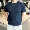 Estilo nuevo de verano moda de Hong Kong moderna holgada diseño de nicho versátil camiseta para hombre adecuada para el uso diario en 2026