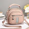 Bolso de mujer 2026 nuevo modelo multibolsillos con cremallera, bolso de mano redondo pequeño, simple y versátil para ir al trabajo, bolso de hombro y cruzado