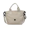 Bolso tote pequeño portátil de estilo ins japonés y coreano, bolso de mano ligero, bolso de hombro y cruzado para mujer, bolsa casual diaria para teléfono