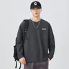 Camiseta de manga larga de marca moderna para hombre, sudadera estampada con letras nueva para primavera y otoño 2026, camiseta básica de cuello redondo, top versátil