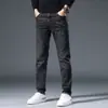 Jeans masculinos de Hong Kong 2026 primavera novo lavagem vintage reto corte slim moderno elástico casual calça comprida
