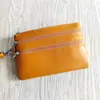 Carteira de moedas de couro bovino de primeira camada, porta-chaves de couro genuíno feminino, bolsa de pulso com zíper, carteira curta solta de couro bovino, atacado