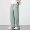 Direto do fabricante: Calça Casual Unissex Plus Size em Tecido Canelado de Seda Gelada, Tendência de Caimento Solto Versátil de Perna Reta, Calça de Perna Larga