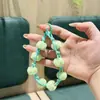 Nuevo estilo otoño e invierno, correa tejida para teléfono con pompón, correa corta de muñeca, funda de teléfono y accesorio para bolso, a la moda y exquisito