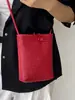 Bolso tejido de nicho único para mujer, nuevo modelo 2026, bolso versátil de hombro y cruzado, exquisito mini bolso para teléfono, bolso de mano pequeño