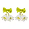 Corea del Sur nuevos pendientes de flor de lirio del valle moda femenina pendientes de lazo de perlas versátiles pendientes de campana dulce elegantes