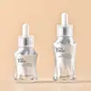 Veta plateada En stock Botella gotero de tapa giratoria de 30 ml Botella de vidrio para aceites esenciales Empaque cosmético Botella rellenable para líquido de esencia