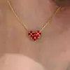 Novo Colar de Trevo de Quatro Folhas Coração em Ouro de Imitação Dupla Face para Mulheres, Luxo Leve, Alto Padrão, Requintado, Moderno, Acessórios Ol Atacado
