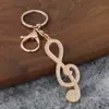 Lujo Ligero Creativo Nota Musical Pedrería Metal Anillo Llavero Bucle Colgador de Llaves para Coche Mochila Cultura de Oficina Llavero
