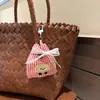 Lindo colgante de bolsa de tela de dibujos animados nuevo con lazo de encaje, decoración de diseño de bolsa de compras, accesorio de mochila al por mayor