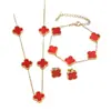 Conjunto de tres piezas de moda de acero de titanio con trébol de cuatro hojas (pulsera, collar y pendientes), venta caliente transfronteriza, joyería de flor de trébol de la suerte al por mayor