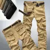 Macacão Novo de Primavera e Outono Masculino Solto Plus Size Reta Casual Calças de Trabalho com Vários Bolsos Marca da Moda Calças de Proteção para Homens