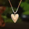 Colgante Largo Geométrico de Flor Hueca Esmaltada de Venta Caliente Transfronteriza Colgante de Collar Todo Fósforo de Corazón de Alta Calidad para Mujer