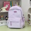 Mochila estilo INS nicho mochila para estudiante de secundaria alta apariencia color puro niña de secundaria gran capacidad ligera femenina mochila de doble hombro