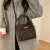 Bolso de Hombro Cruzado Tipo Cubo Versátil Casual Estilo Retro de Nicho para Mujer 2026